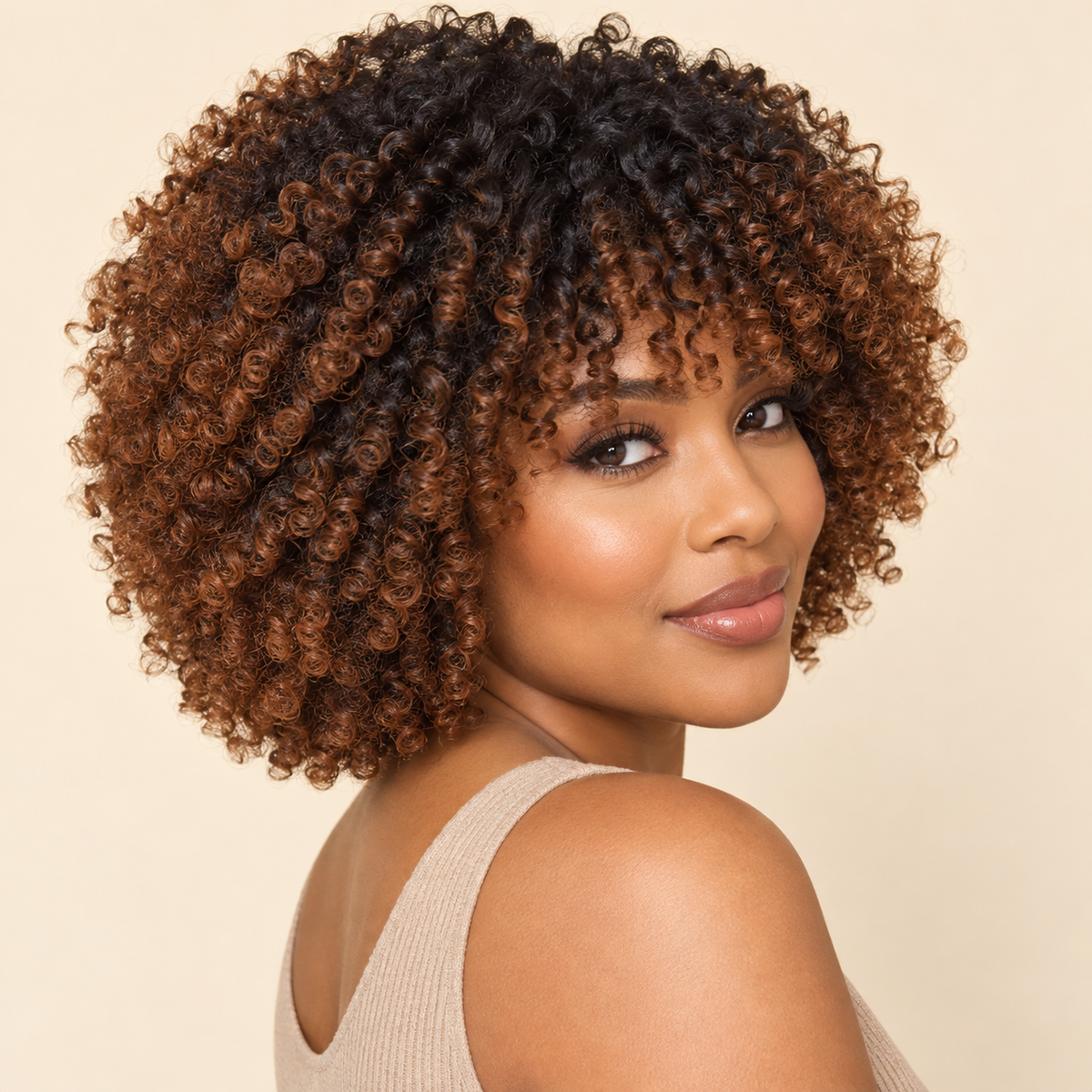 Short kinky-curly afro wig with dark roots and copper-brown ombre, adult model three-quarter view. AI-generated visualization.